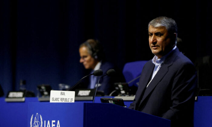 Head of Atomic Energy Organization of Iran Mohammad Eslami and International Atomic Energy Agency Director General Rafael Grossi attend the opening of the IAEA General Conference at their headquarters in Vienna, Austria, on Sept. 26, 2022. (Leonhard Foeger/Reuters)