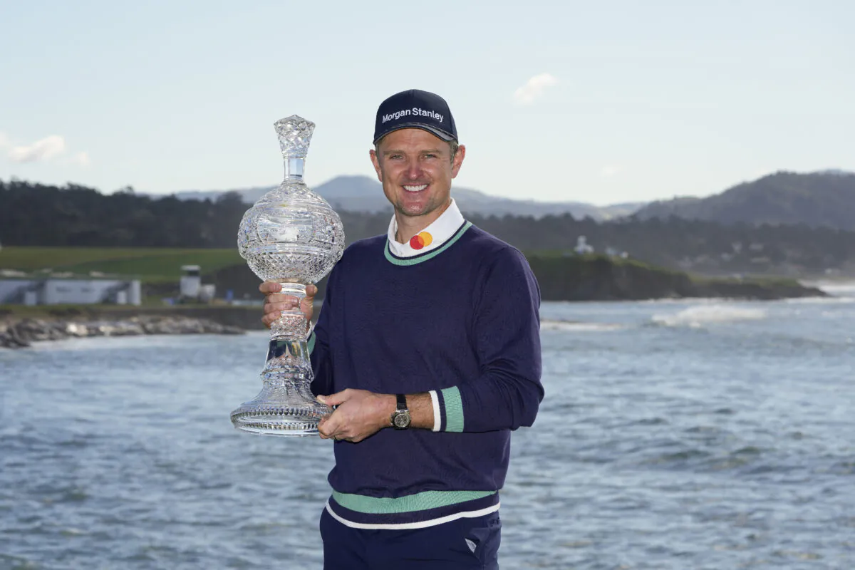 Justin Rose, of England, poses for a photograph with the trophy after winning the AT&T Pebble Beach Pro-Am golf tournament in Pebble Beach, Calif., on Feb. 6, 2023. (Godofredo A. Vásquez/AP Photo)
