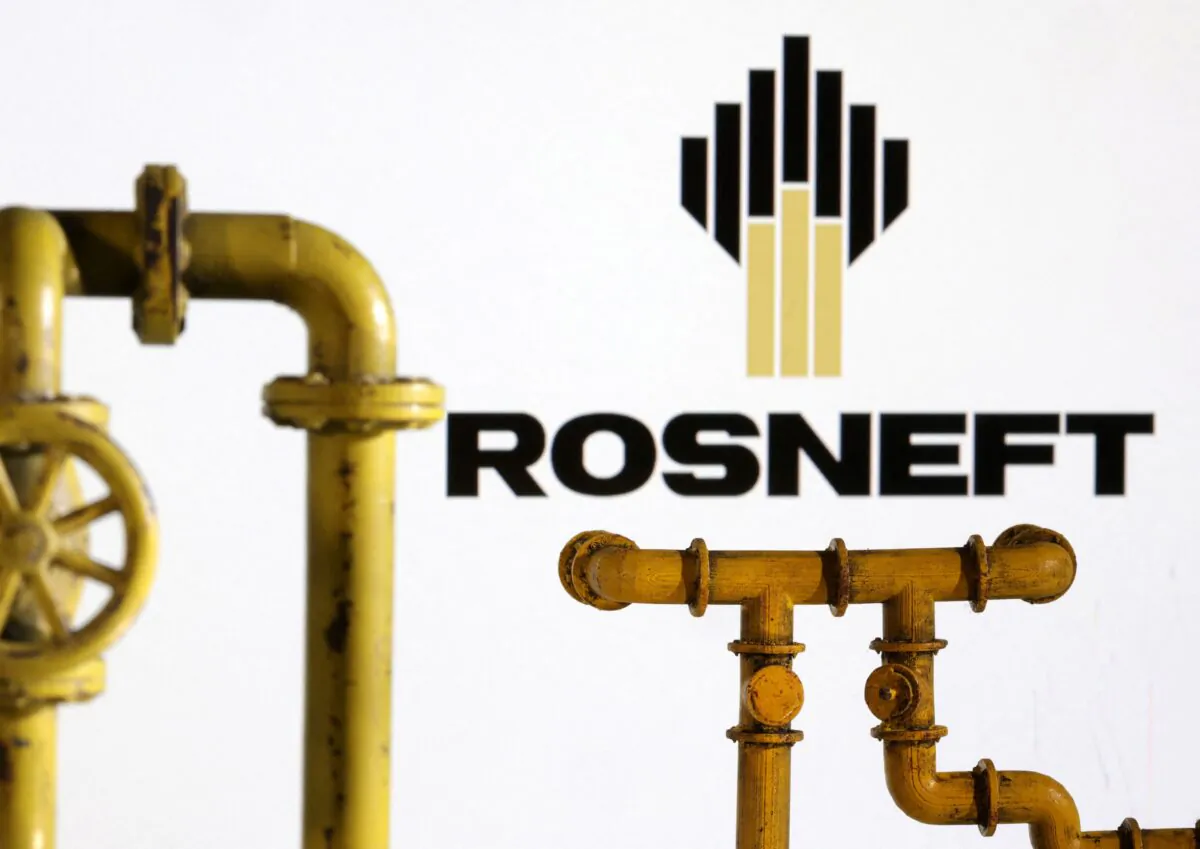 Model of natural gas pipeline and Rosneft logo, on July 18, 2022. (Dado Ruvic/Illustration/Reuters)