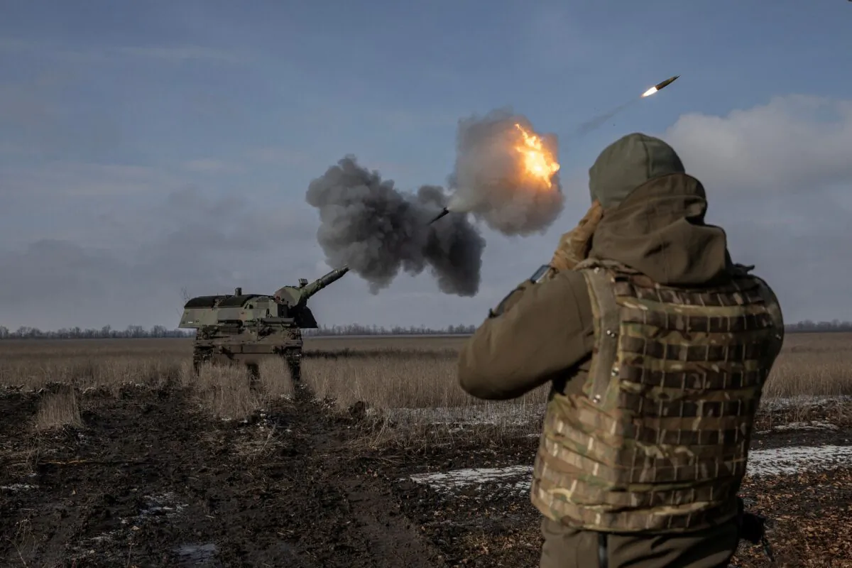 Ukrainian army from the 43rd Heavy Artillery Brigade fire the German howitzer Panzerhaubitze 2000, called Tina by the unit, near Bahmut, in Donetsk region, Ukraine, on Feb. 5, 2023. (Marko Djuica/Reuters)