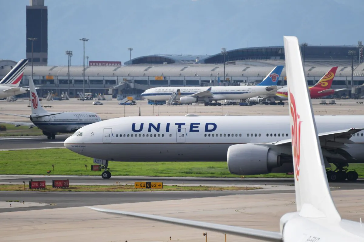 A United Airlines Boeing 777 aircraft waits to take off at Beijing airport on July 25, 2018. (Greg Baker/AFP via Getty Images)