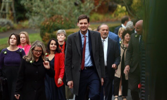 Premier David Eby arrives with ministers before the start of the swearing-in ceremony at Government House in Victoria, B.C., on Dec. 7, 2022. (The Canadian Press/Chad Hipolito)