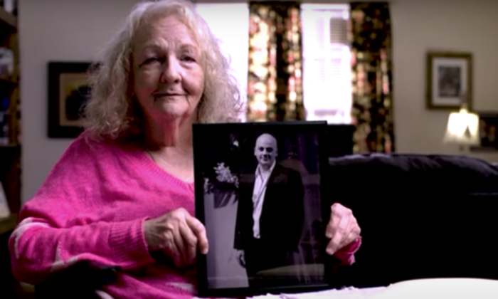 Texas resident Katherine Swidan holds a picture of her son Mark Swidan who has been held in China for a decade. (Courtesy of the Swidan family)