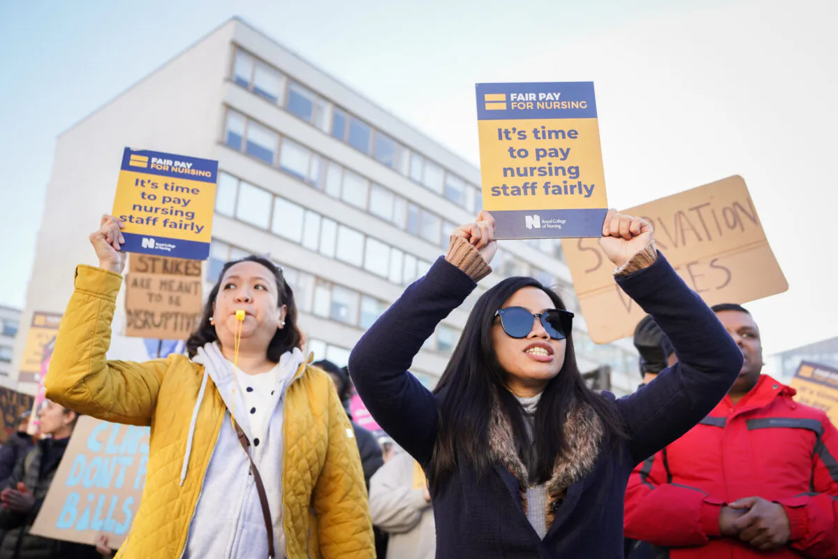 Workers on the picket line during a strike by nurses and ambulance staff outside St. Thomas's Hospital in London, on Feb. 6, 2023. (James Manning/PA Media)