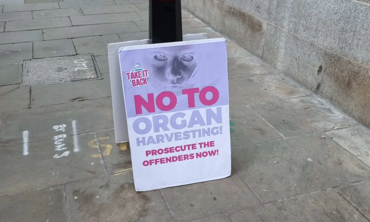 A placard outside the trial of Nigerian Sen. Ike Ekweremadu, his wife, daughter, and another man, at the Old Bailey in London, on Feb. 7, 2023. (Chris Summers/The Epoch Times)