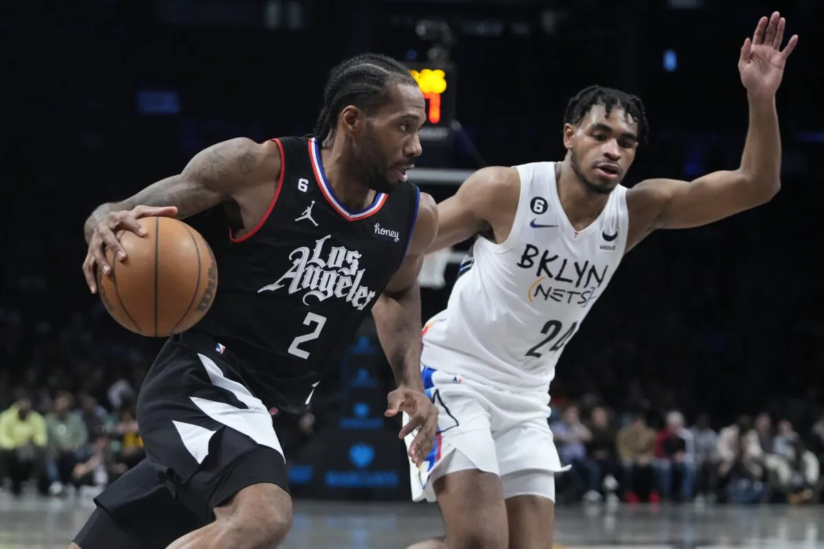 Los Angeles Clippers' Kawhi Leonard (2) drives past Brooklyn Nets' Cam Thomas (24) during the second half of an NBA basketball game in New York on Feb. 6, 2023. (Frank Franklin II/AP Photo)