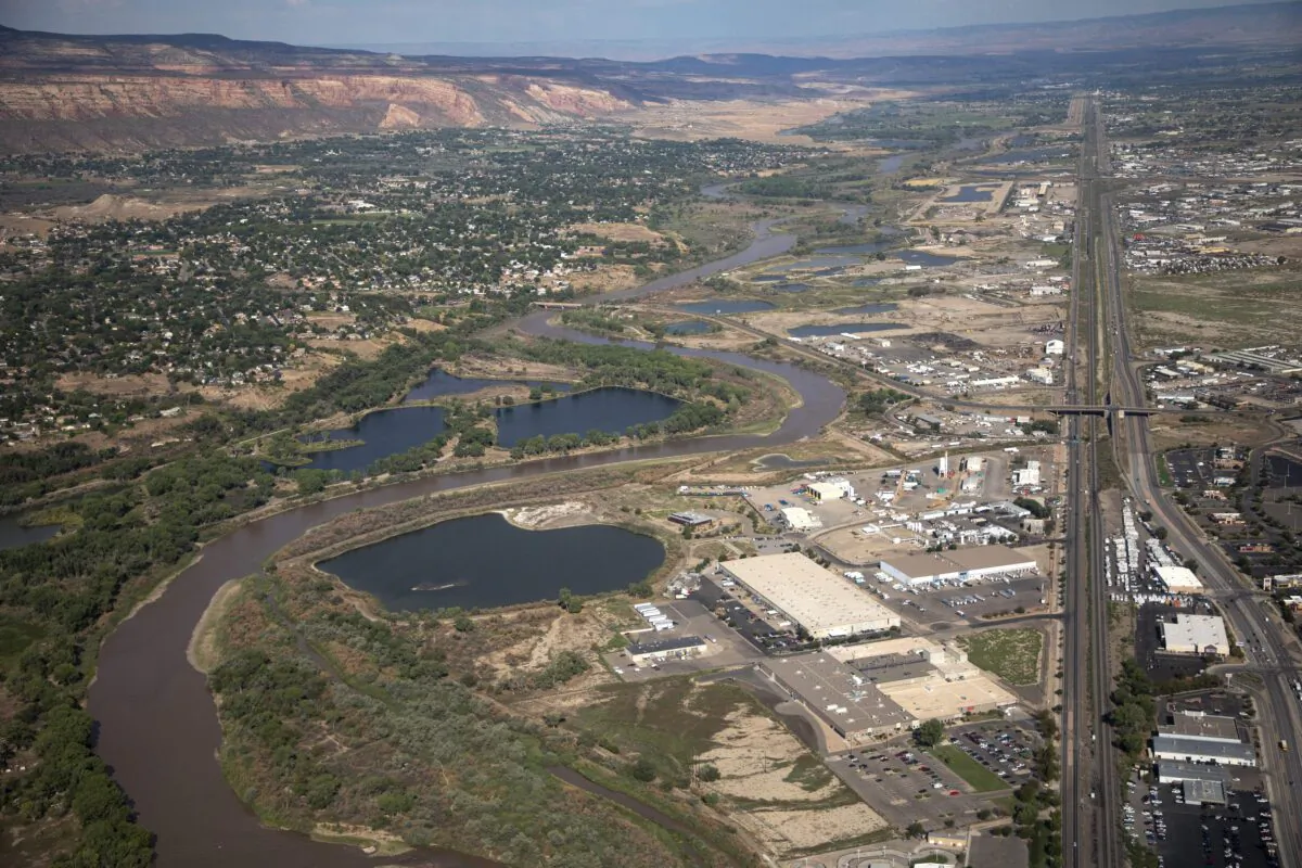 The Colorado River passes through Grand Junction in Mesa County, Colo., on Aug. 24, 2022. (Hugh Carey/The Colorado Sun via AP)