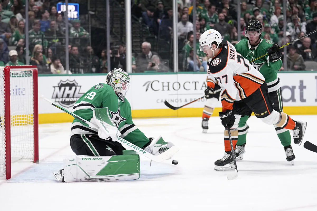 Dallas Stars goaltender Jake Oettinger (29) defends against a shot while under pressure from Anaheim Ducks right wing Frank Vatrano (77) in the second period of an NHL hockey game in Dallas on Feb. 6, 2023. (Tony Gutierrez/AP Photo)
