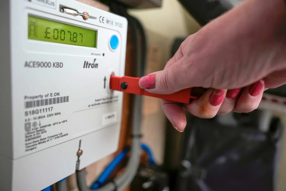 A prepay electricity key sits in a prepayment electricity meter in a rented home in Birmingham, England, on Feb. 7, 2023. (Christopher Furlong/Getty Images)