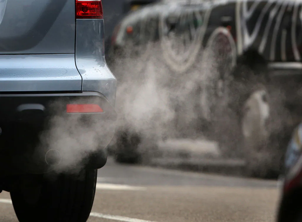 Exhaust fumes from a car in Putney High Street, in Putney, England, on Jan. 10, 2013. Local media are reporting local environmental campaigners claims that levels of traffic pollutants, mostly nitrogen dioxide, have breached upper safe limits in the busy street in south west London. (Peter MacDiarmid/Getty Images)