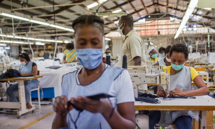 People work at a factory in Port-au-Prince, Haiti, in a file photo. (Pierre Michel Jean/AFP via Getty Images)