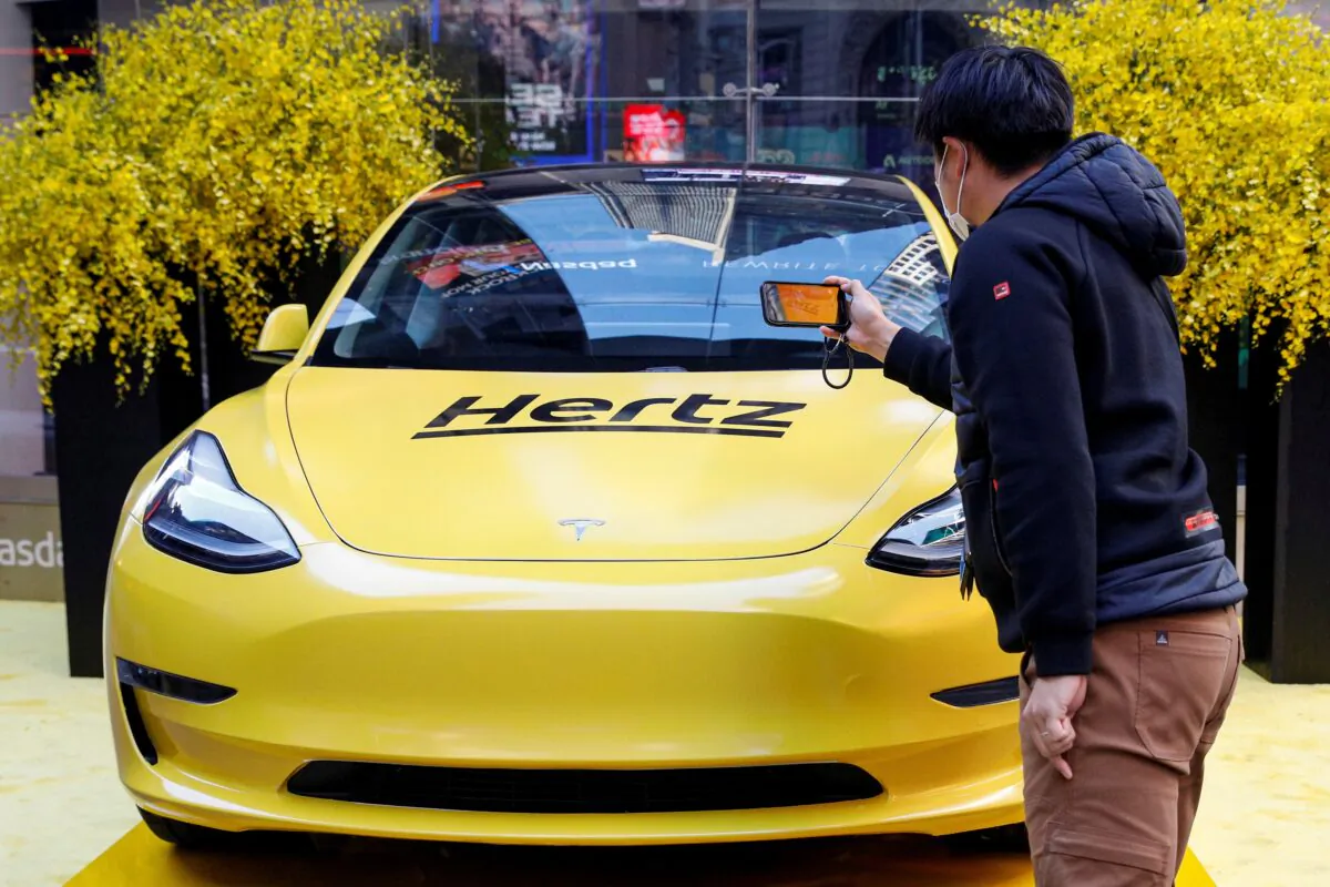 A Hertz Tesla electric vehicle is on display during the Hertz Corporation IPO at the Nasdaq Market site in Times Square in New York on Nov. 9, 2021. (Brendan McDermid/Reuters)