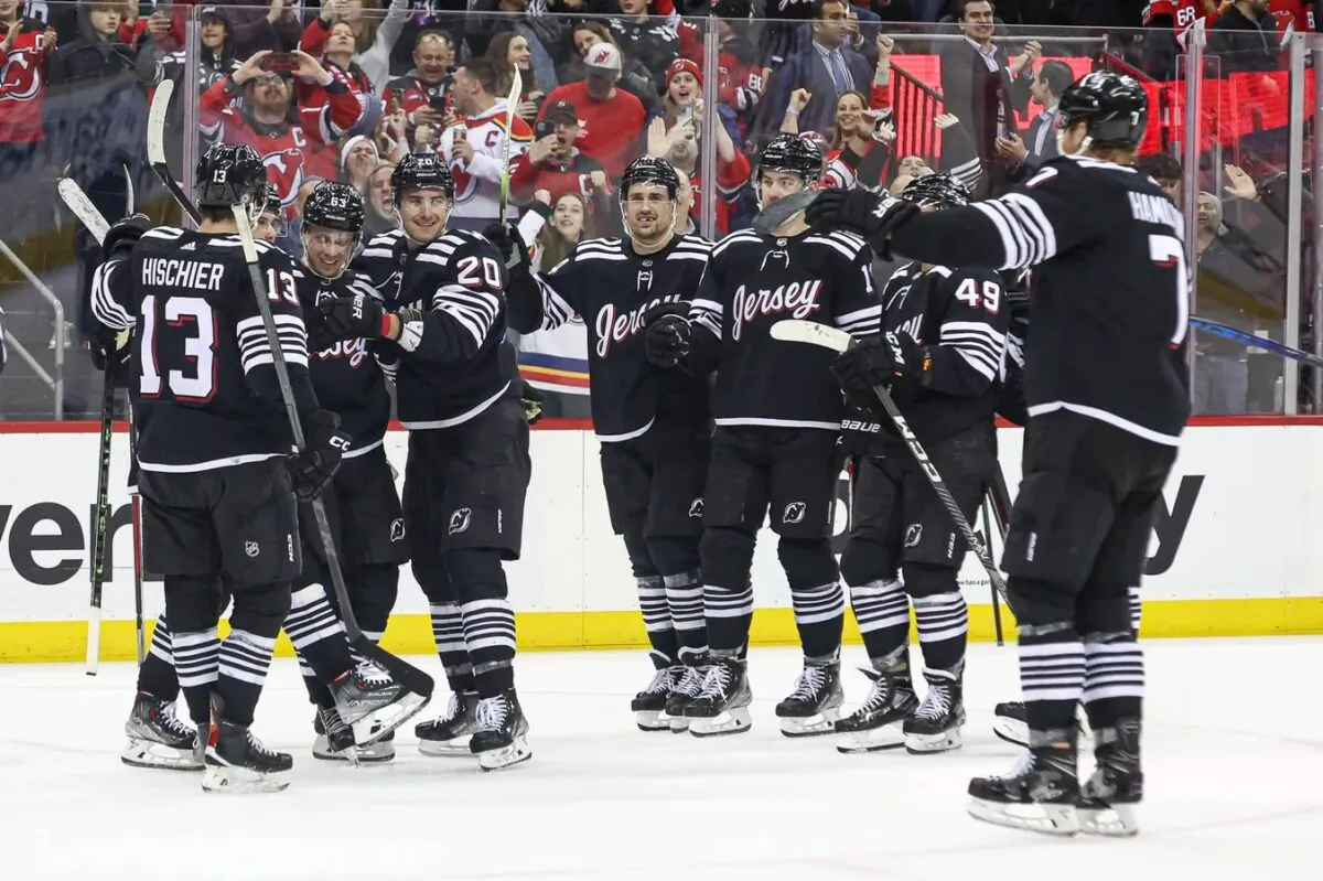 New Jersey Devils left wing Jesper Bratt (63) celebrates with teammates after scoring the game winning goal in overtime against the Vancouver Canucks at Prudential Center in Newark, N.J., on Feb. 6, 2023. (Vincent Carchietta/USA TODAY Sports via Field Level Media)
