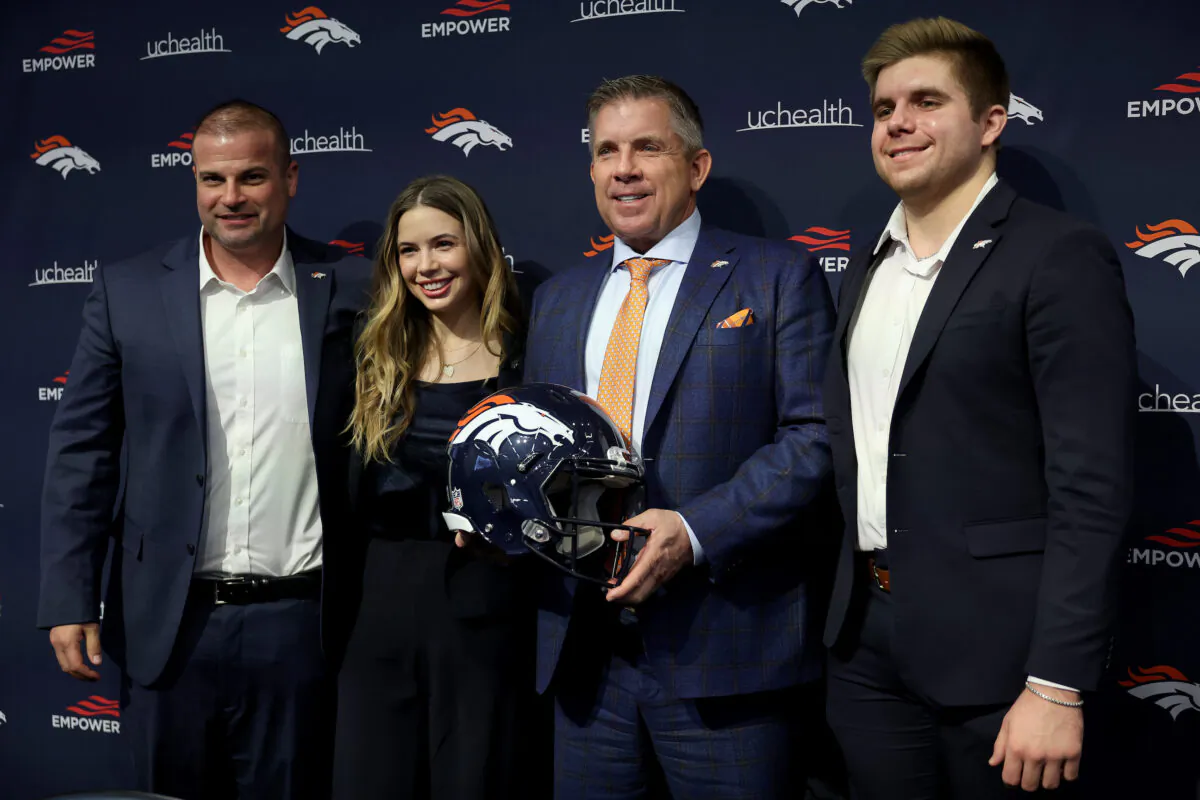 New Denver Broncos Head Coach Sean Payton poses with Christopher Titone and family members Meghan Payton and Connor Payton during a press conference at UCHealth Training Center in Englewood, Colorado on Feb. 6, 2023. (Matthew Stockman/Getty Images)