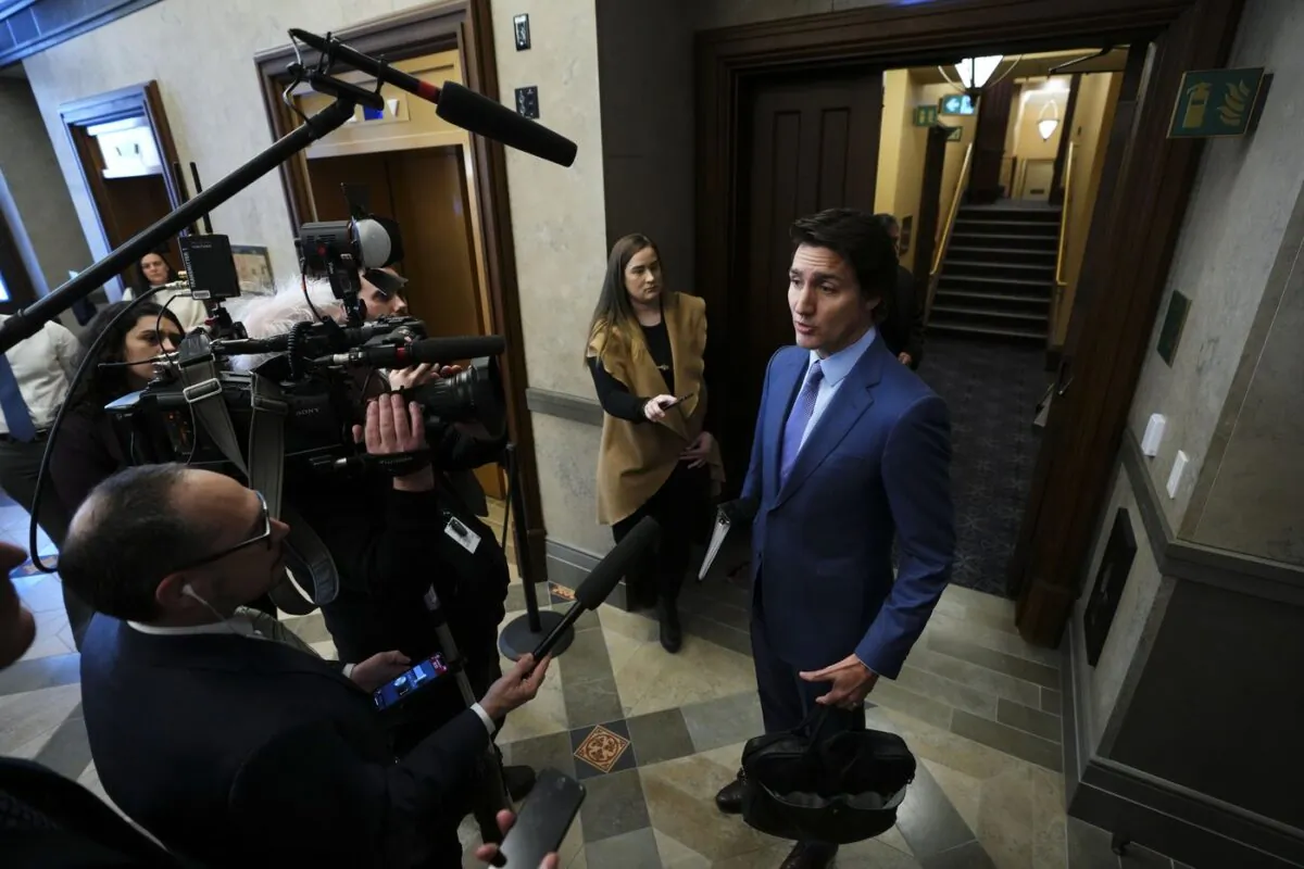 Prime Minister Justin Trudeau talks to reporters in the foyer as he arrives for question period in the House of Commons on Parliament Hill in Ottawa on Feb. 6, 2023. (The Canadian Press/Sean Kilpatrick)