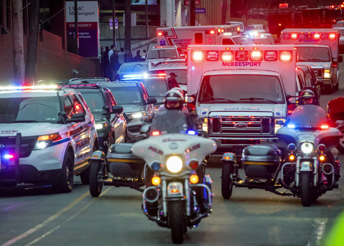 Members of the Pittsburgh police motorcycle unit lead a procession that includes the body of a fallen McKeesport police officer as it leaves UPMC McKeesport in McKeesport, Pa., on  Feb. 6, 2023. (Arturo Fernandez/Pittsburgh Post-Gazette via AP)