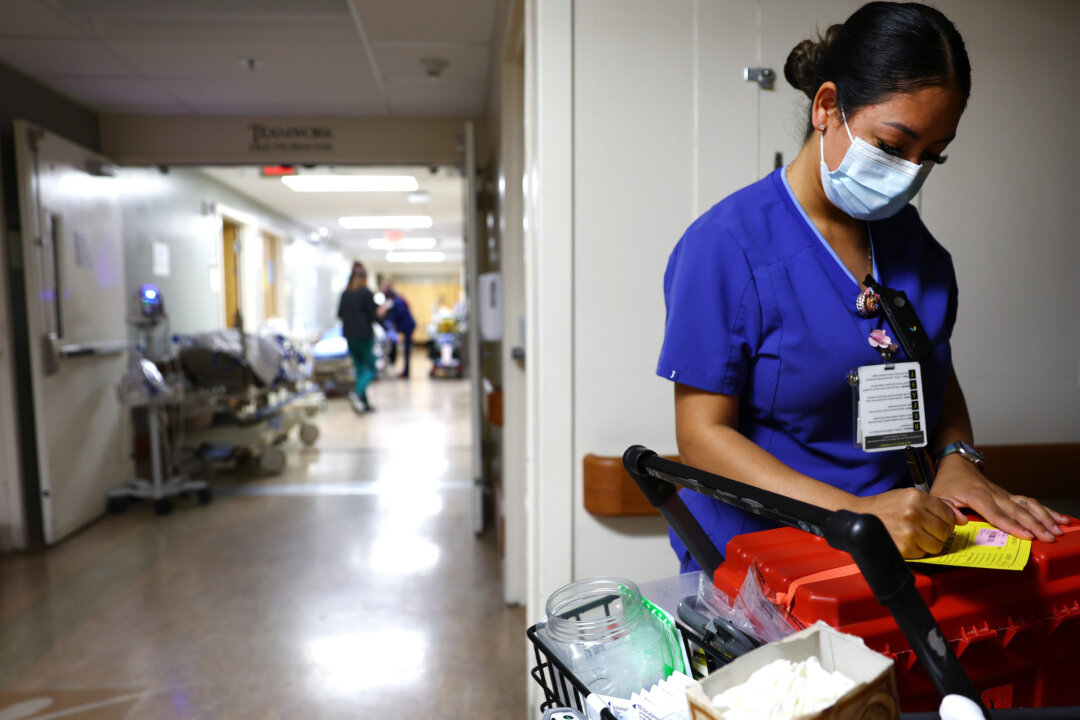 A lab technician works in the Emergency Department at Providence St. Mary Medical Center in Apple Valley, Calif., on March 11, 2022. (Mario Tama/Getty Images)