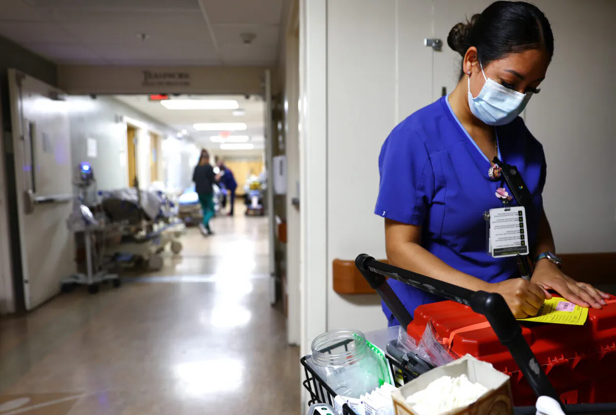 A lab technician works in the Emergency Department at Providence St. Mary Medical Center in Apple Valley, Calif., on March 11, 2022. (Mario Tama/Getty Images)