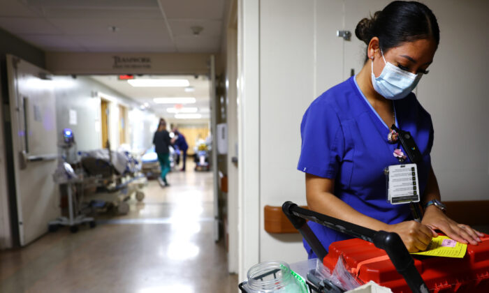A lab technician works in the Emergency Department at Providence St. Mary Medical Center in Apple Valley, Calif., on March 11, 2022. (Mario Tama/Getty Images)