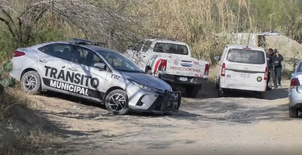 Police and Civil Protection vehicles at a cordoned-off area where authorities found bodies of 14 people in an overturned pickup truck in Pesquería, Mexico, on Feb. 7, 2023, in a still from video. (Televisa via AP/Screenshot via The Epoch Times)