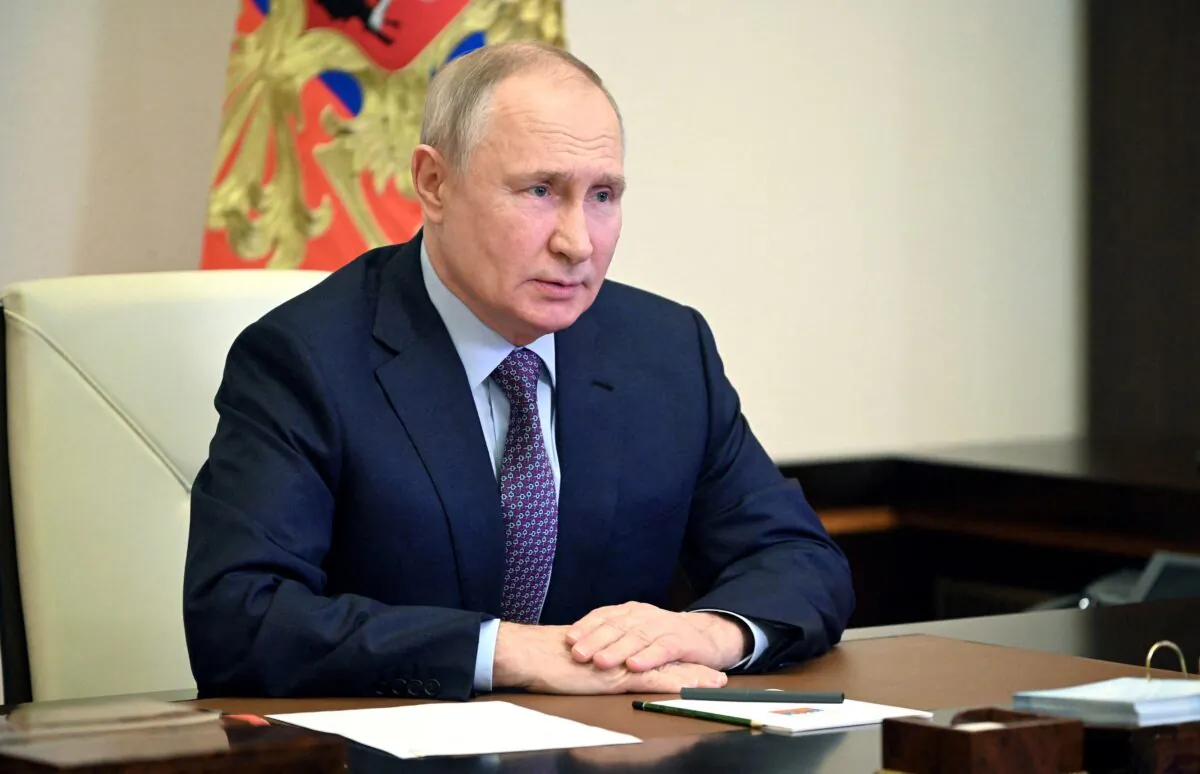 Russian President Vladimir Putin chairs a meeting with members of the Security Council via a video link at the Novo-Ogaryovo state residence outside Moscow on Feb. 3, 2023. (Sputnik/Pavel Byrkin/Kremlin via Reuters)