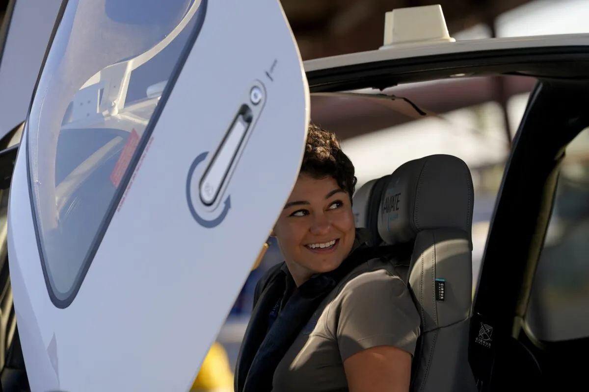 United Aviate Academy student pilot Ashley Montano inspects her aircraft prior to a flight in Goodyear, Ariz., on Oct. 28, 2022. (Matt York/AP Photo)