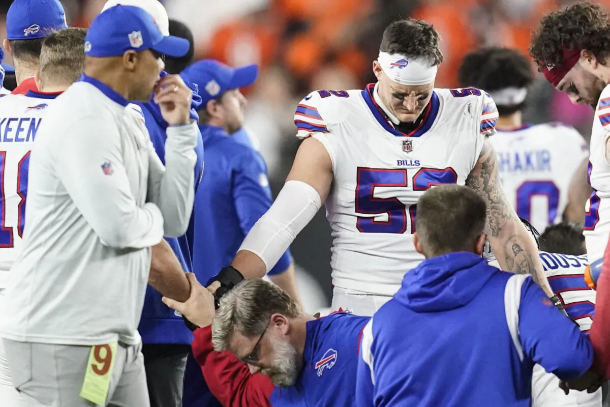 Buffalo Bills players and staff pray for Buffalo Bills' Damar Hamlin during the first half of an NFL football game against the Cincinnati Bengals, Monday, Jan. 2, 2023, in Cincinnati. When medical personnel rushed onto the field to save Damar Hamlin’s life after the Buffalo Bills’ defensive back collapsed during a game last month in Cincinnati, many people witnessing the horrifying scene did the only thing they could to help. They prayed.(Joshua A. Bickel/AP Photo)
