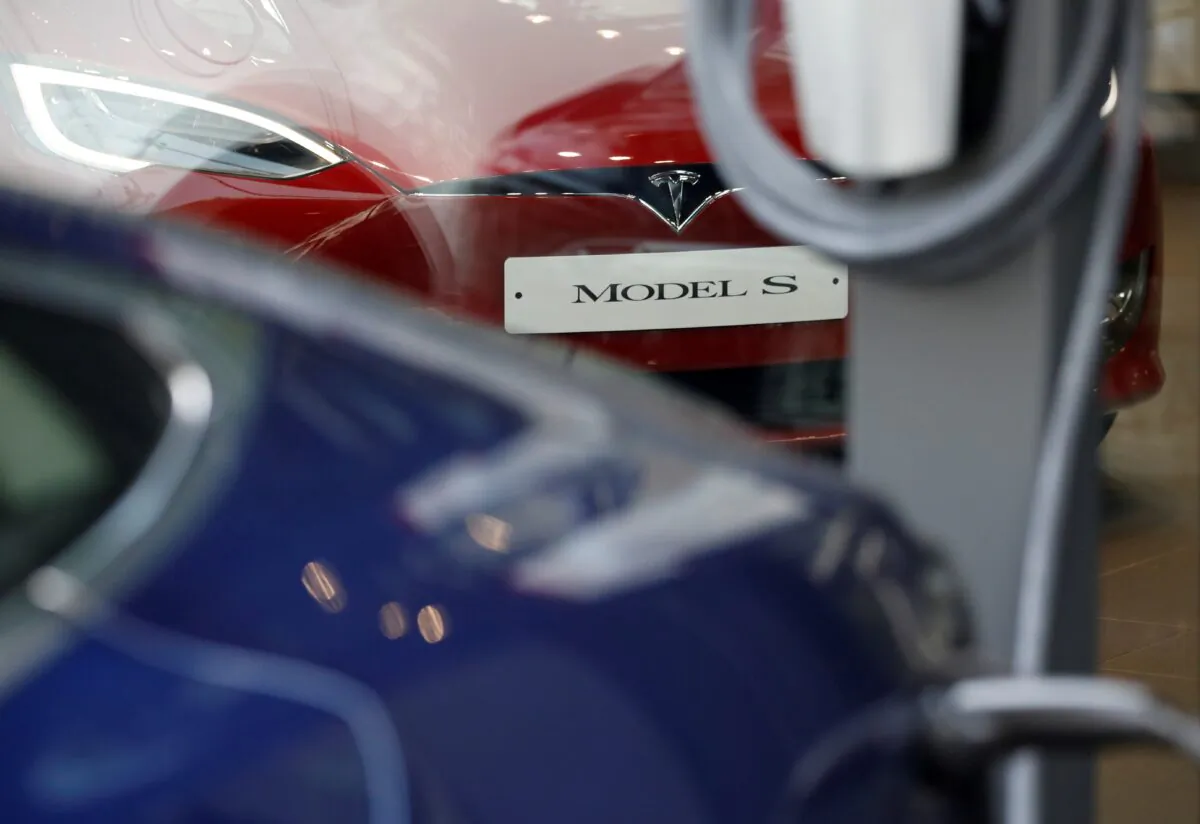 A Tesla Model S electric car is charged by a Destination Charger at its dealership in Seoul, South Korea, on July 6, 2017. (Kim Hong-Ji/Reuters)