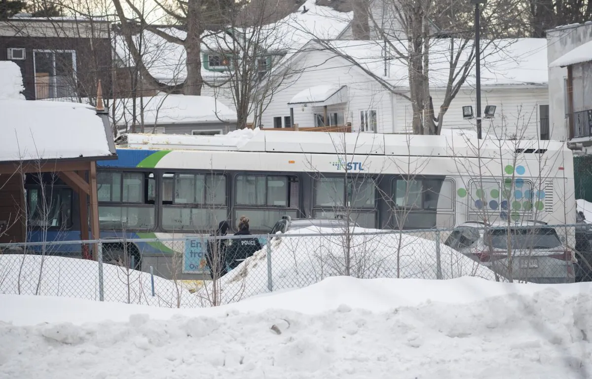 A city bus is shown next to a daycare centre in Laval, Que, on Feb. 8, 2023, where the driver crashed it into the building leaving two children dead. (The Canadian Press/Graham Hughes
Graham Hughes)