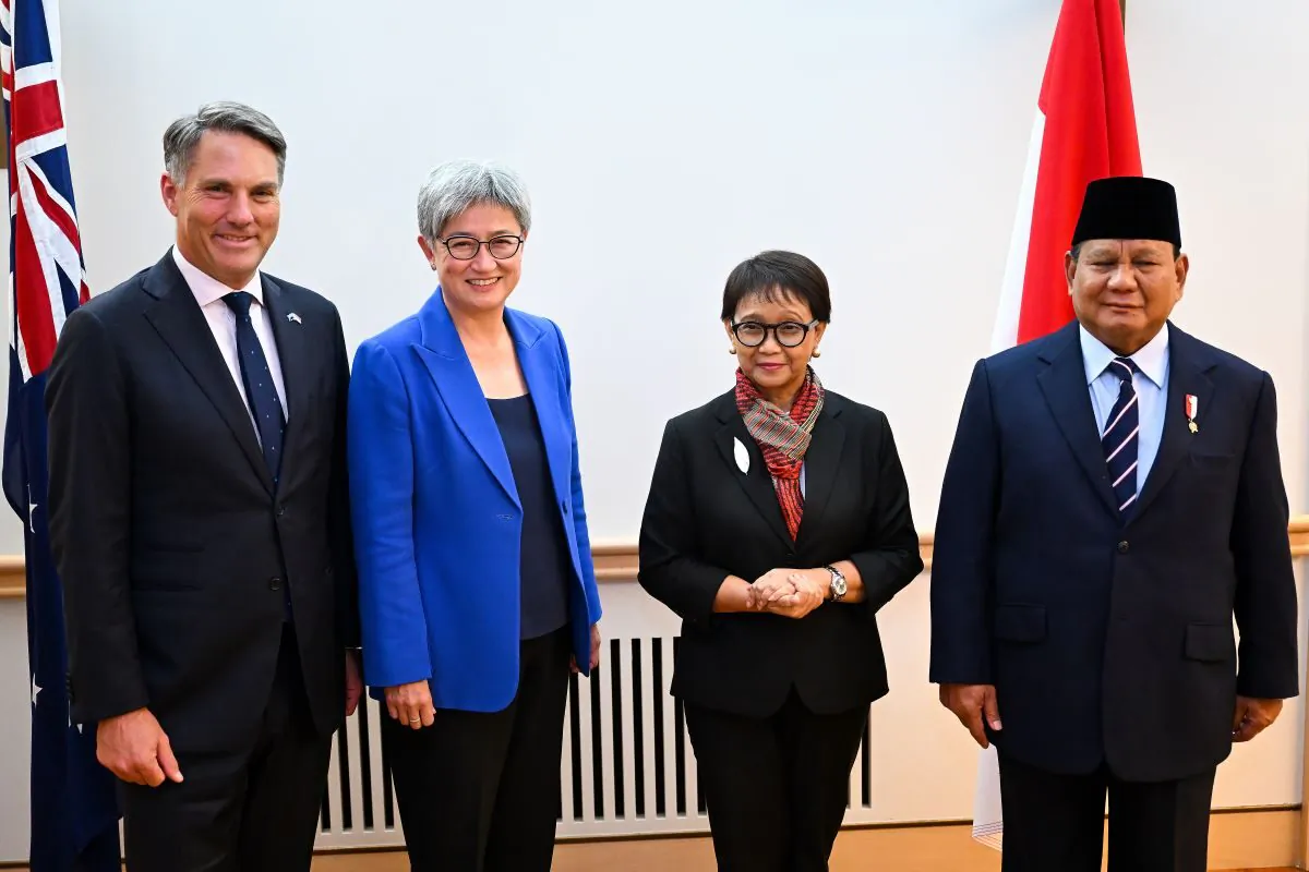 (L-R) Australian Deputy Prime Minister Richard Marles, Australian Foreign Minister Penny Wong, Indonesian Foreign Minister Retno Marsudi and Indonesian Defence Minister Prabowo Subianto pose for photographs during the 8th Australian-Indonesia 2+2 Foreign and Defence Ministers’ Meeting at Parliament House in Canberra, Thursday, February 9, 2023. (AAP Image/Lukas Coch) 