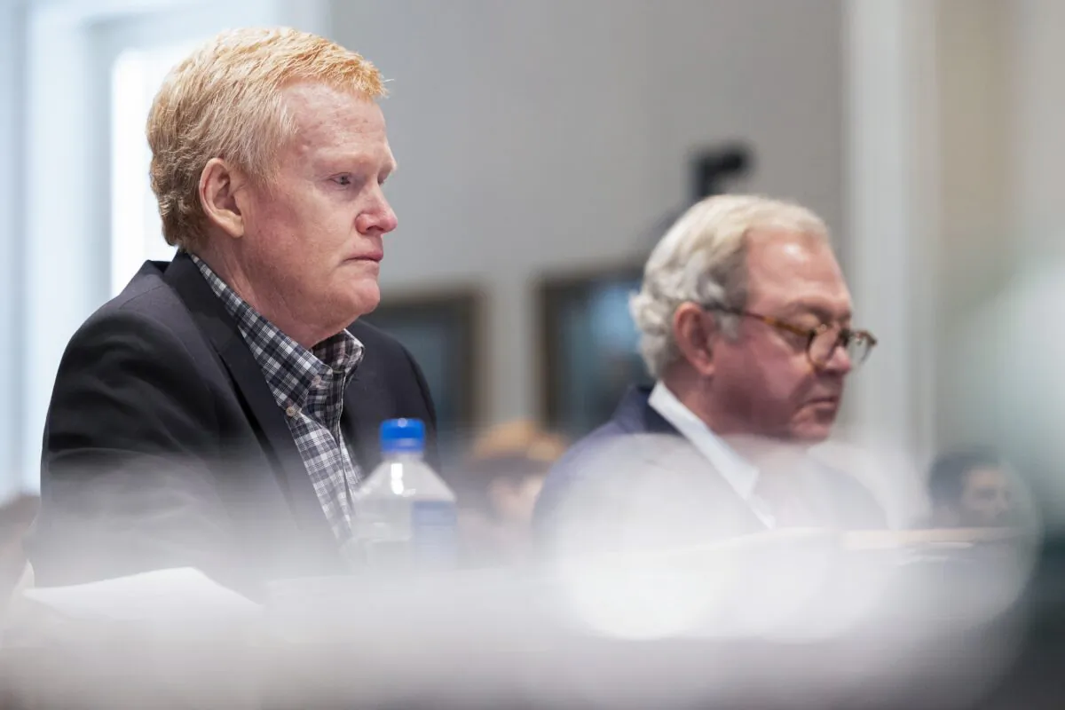 Alex Murdaugh (L) listens to his friend Chris Wilson testify during his double murder trial at the Colleton County Courthouse in Walterboro, S.C., on Feb. 9, 2023. (Joshua Boucher/The State via AP, Pool)