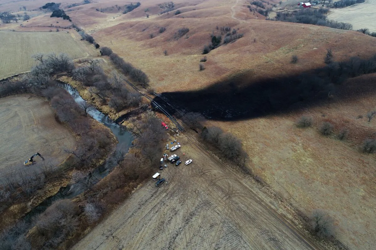 Ccleanup continues in the area where the ruptured Keystone pipeline dumped oil into a creek in Washington County, Kan., on Dec. 9, 2022. (DroneBase via AP)