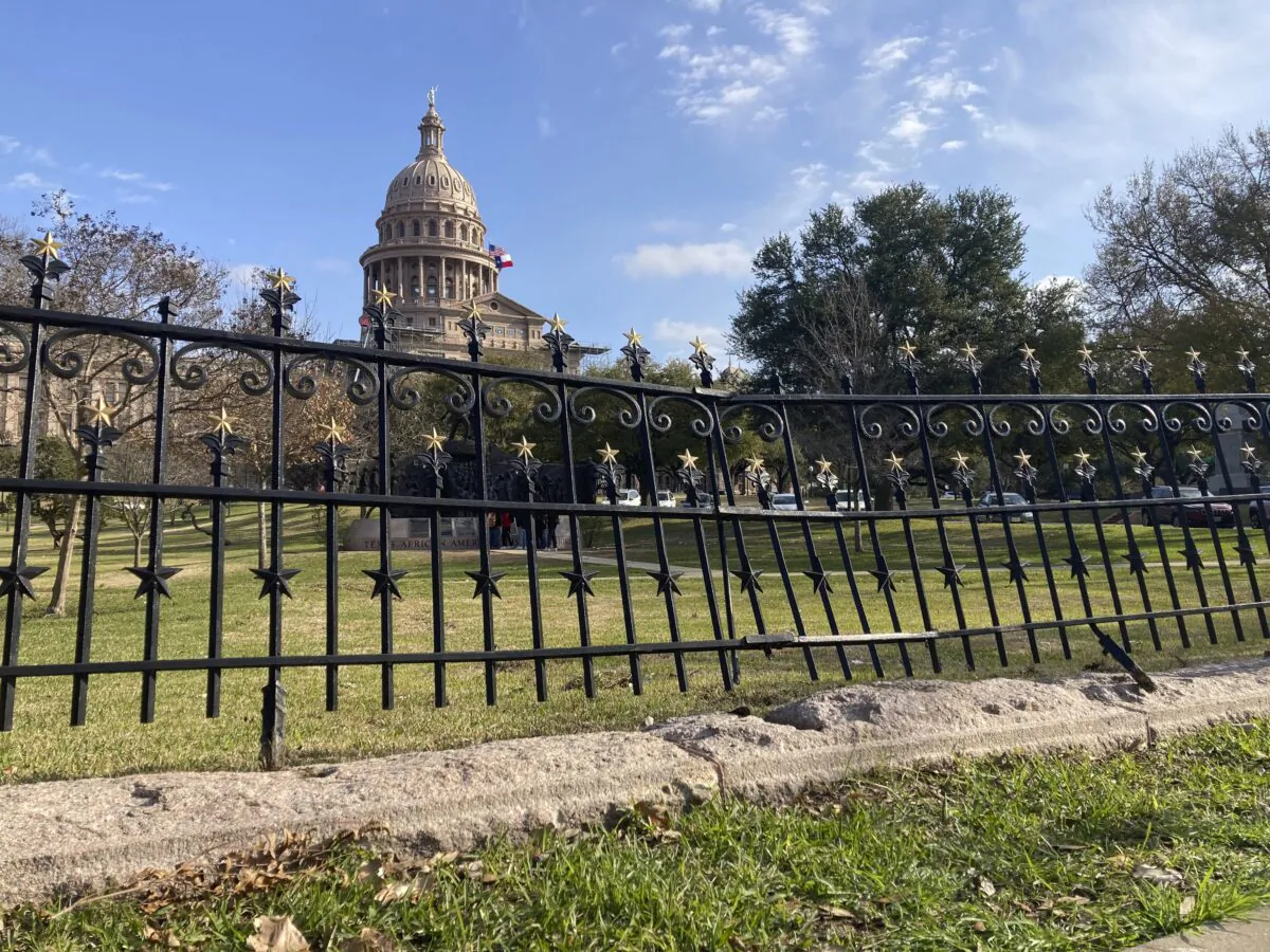 A fence outside the Texas Capitol remained mangled in Austin, Texas, on Feb. 10, 2023, after authorities said a driver crashed through the barrier and drove up the south steps of the building. (Jim Vertuno/AP Photo)