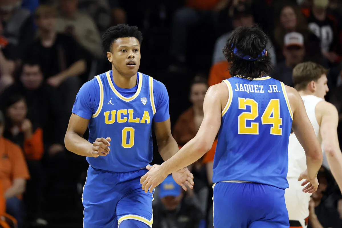 Jaylen Clark (0) of the UCLA Bruins celebrates a basket with teammate Jaime Jaquez Jr. (24) during the first half against the Oregon State Beavers at Gill Coliseum in Corvallis, Ore., on Feb. 9, 2023. (Soobum Im/Getty Images)