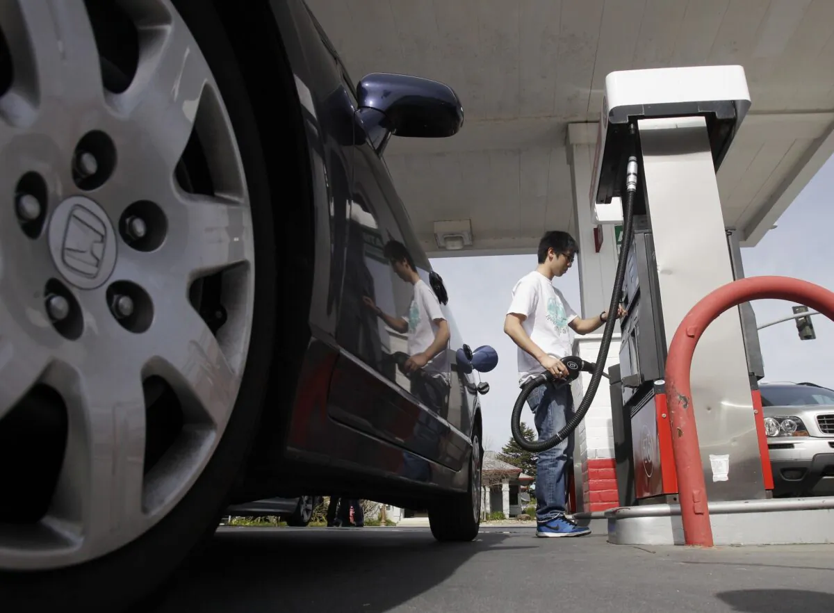 A motorist fuels up at a gas station in Santa Cruz, Calif., on March 7, 2011. A leak in a fuel pipeline facility in California has forced a shutdown of deliveries of gasoline and diesel from Los Angeles to areas including Las Vegas and Phoenix. (Marcio Jose Sanchez/AP Photo)
