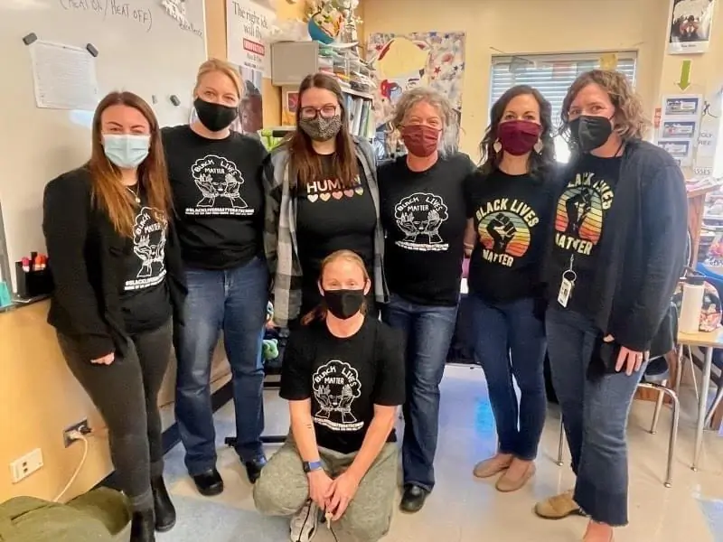 Teachers in Colorado's Cherry Creek school district wear T-shirts with political messages. Moms and dads from the Colorado Parents Advocacy Network object to what their children are now being taught in school. (Courtesy of Colorado Parents Advocacy Network)