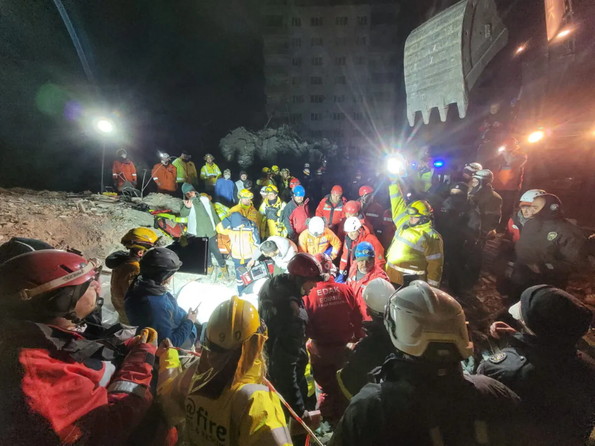 Rescue workers try to rescue a 15-year-old girl trapped under the rubble, in the aftermath of a deadly earthquake in Kahramanmaras, Turkey, on Feb. 10, 2023. (@fire - Internationaler Katastrophenschutz/Handout via Reuters)
