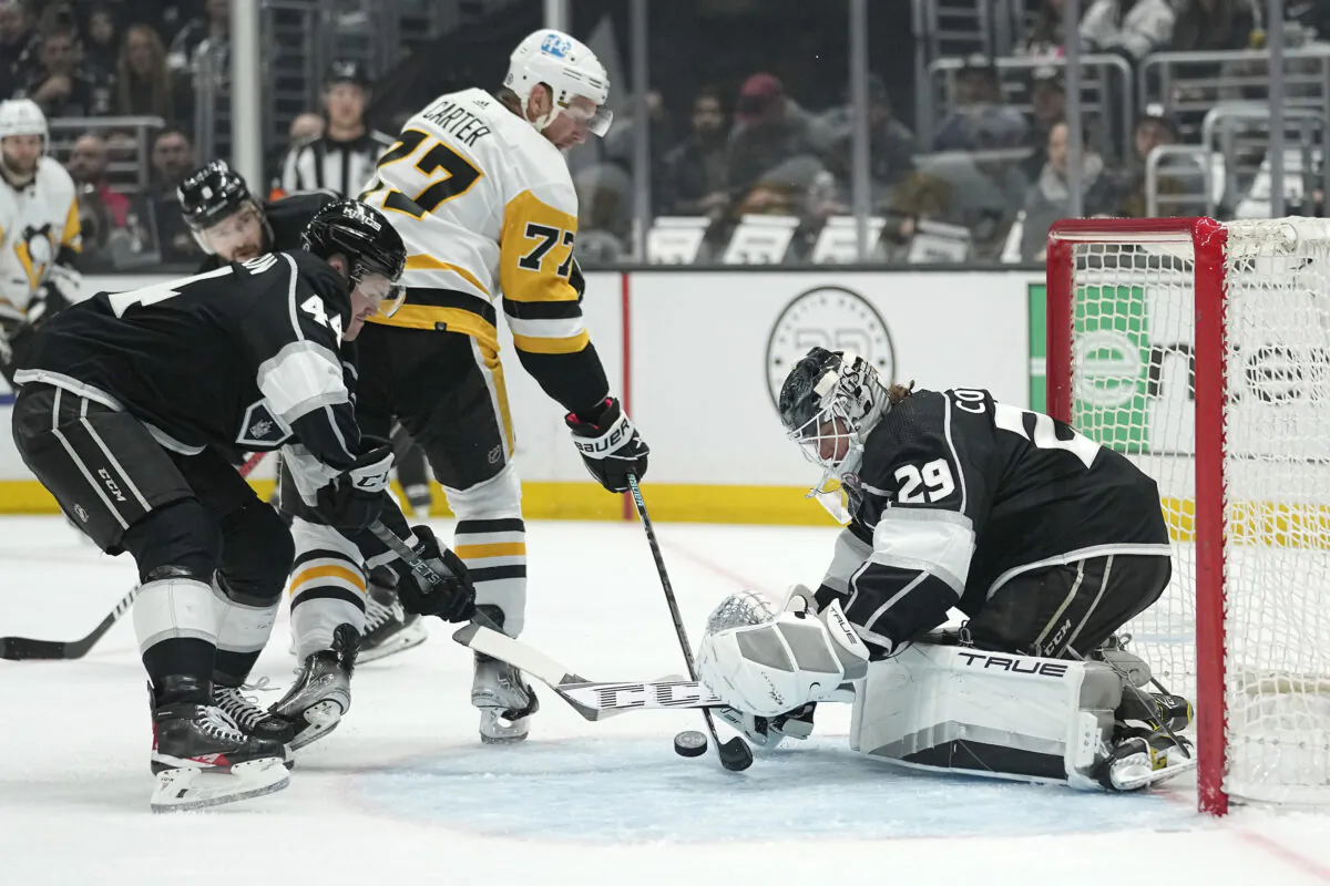 Pittsburgh Penguins center Jeff Carter, center, tries to score on Los Angeles Kings goaltender Pheonix Copley, right, as defenseman Mikey Anderson defends during the first period of an NHL hockey game in Los Angeles on Feb. 11, 2023. (Mark J. Terrill/AP Photo)