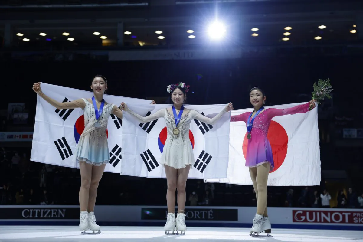 South Korea's Gold medalist Haein Lee (C), South Korea's silver medalist Yelim Kim (L), and Japan's bronze medalist Mone Chiba during a ceremony for the women's competition during the ISU Four Continents Figure Skating Championships in Colorado Springs, Colo., on Feb. 10, 2023. (Michael Ciaglo/USA TODAY Sports via Reuters)