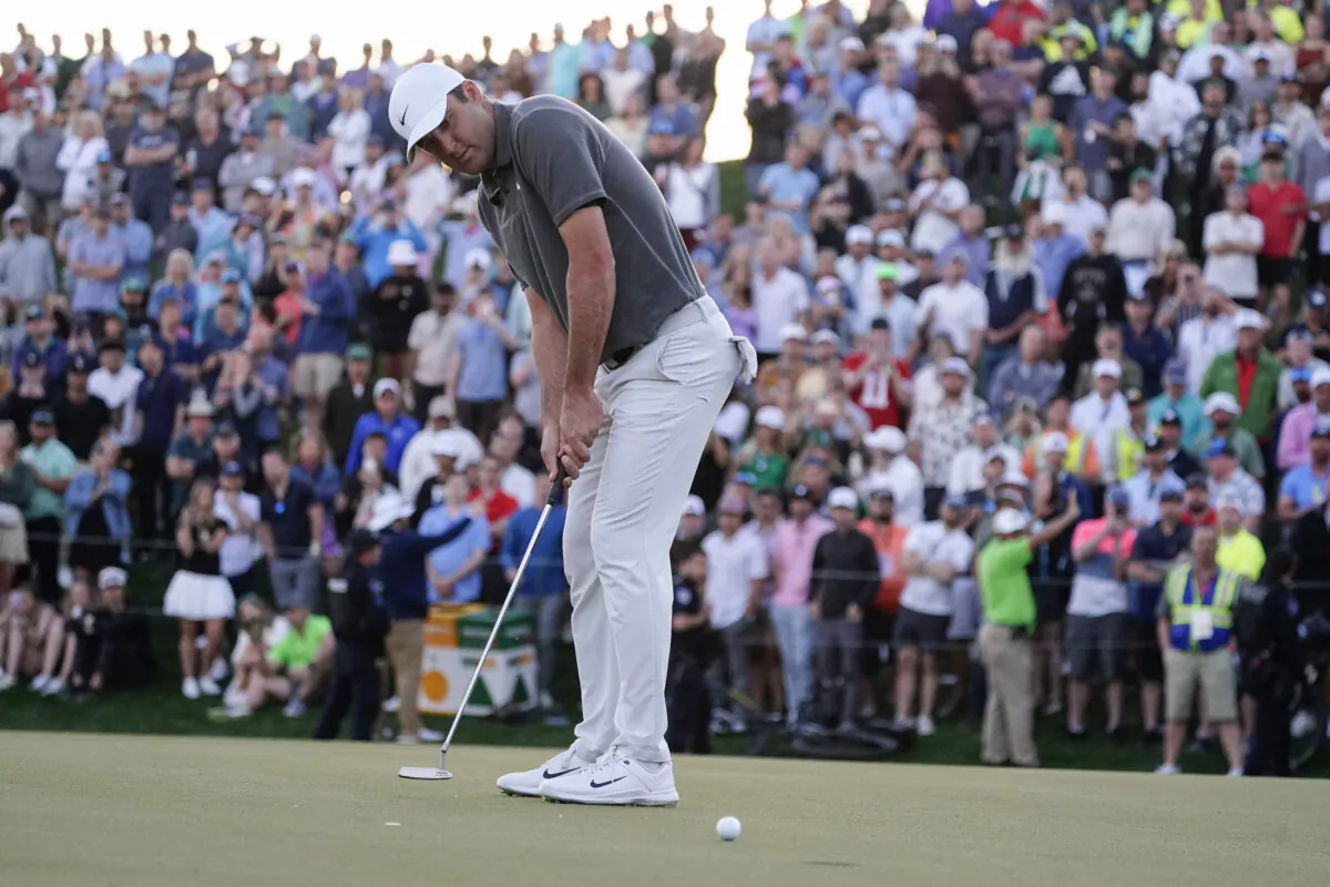 Scottie Scheffler putts on the 18th hole during the third round of the Phoenix Open golf tournament, in Scottsdale, Ariz., on Feb. 11, 2023. (Darryl Webb/AP Photo)