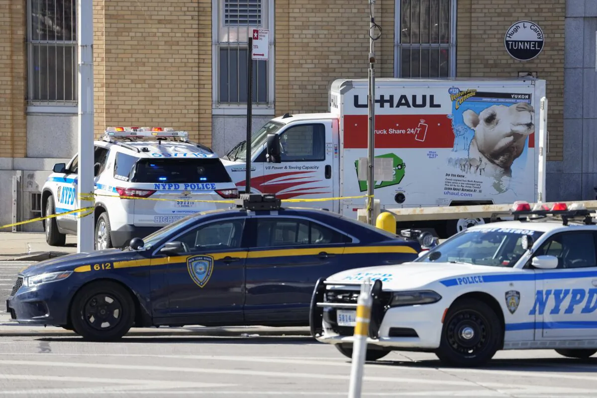 Police vehicles surround a truck that was stopped and the driver arrested in New York on Feb. 13, 2023. (John Minchillo/AP Photo)