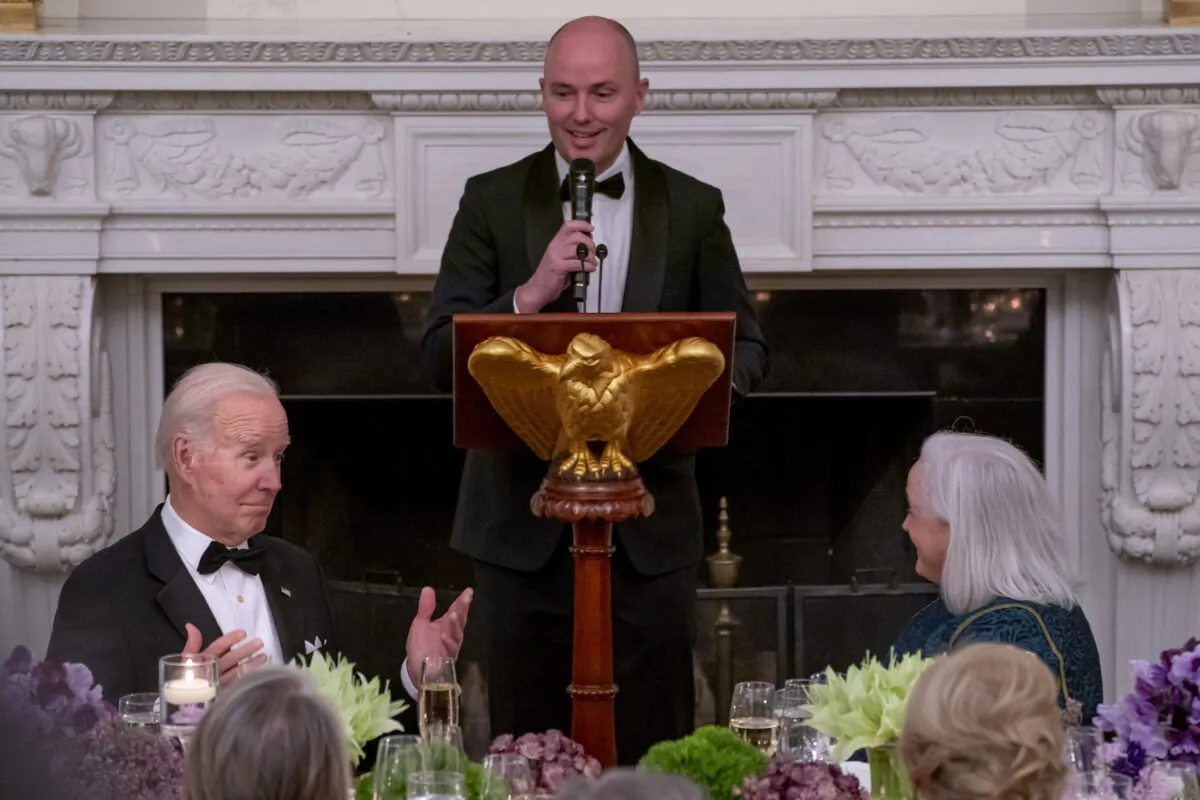 President Joe Biden reacts as National Governors Association Vice Chair, Governor Spencer Cox of Utah delivers a toast during a black-tie dinner in the State Dining Room at the White House on Feb. 11, 2023. (Nathan Howard/Getty Images)
