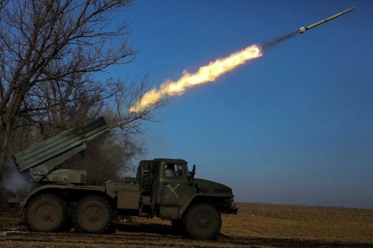 Ukrainian servicemen fire a BM-21 Grad multiple launch rocket system towards Russian troops, Ukraine, on Feb. 11, 2023. (Yevhenii Zavhorodnii/Reuters)