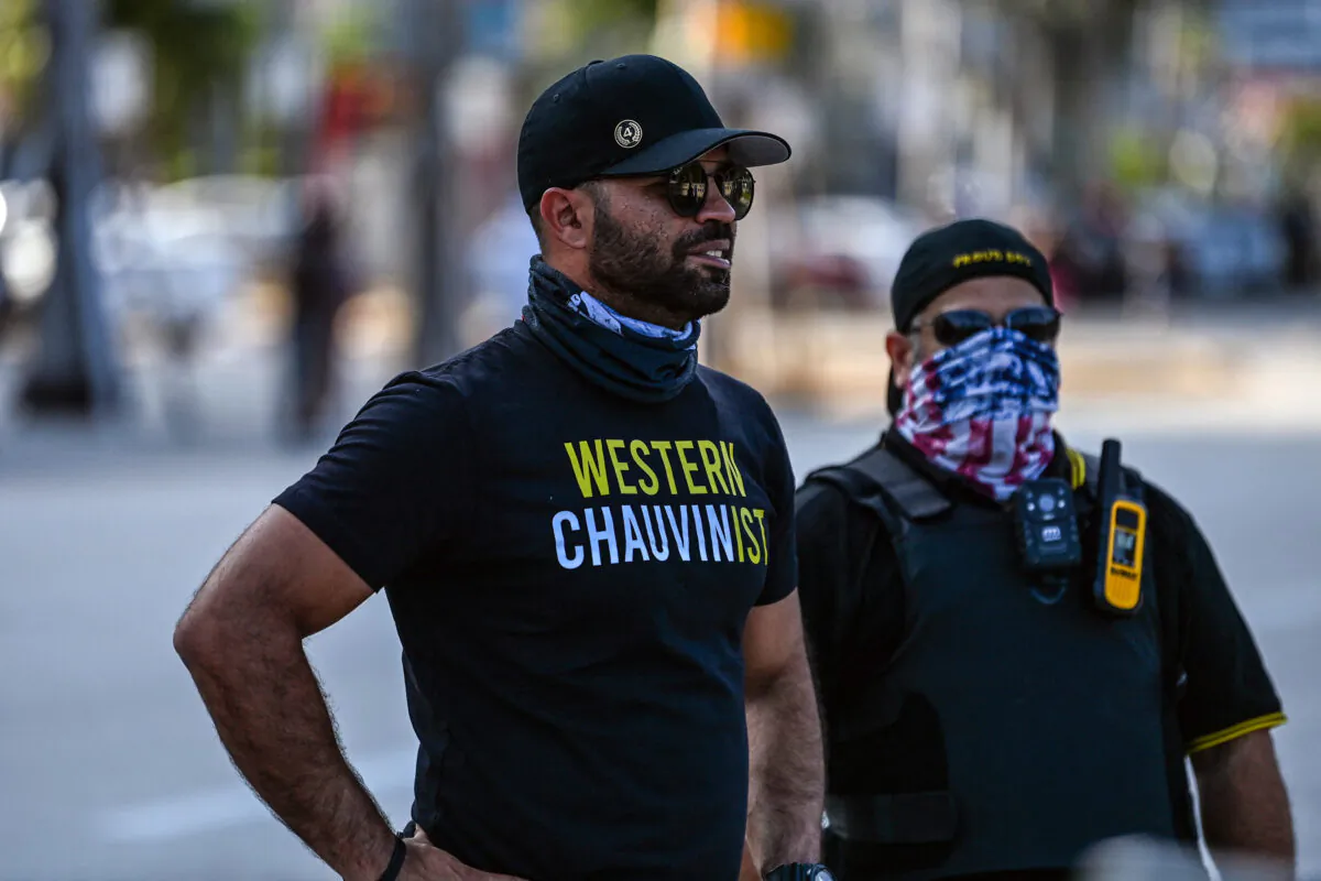 Then-chairman of the Proud Boys Enrique Tarrio (L),  looks on while counter-protesting near the Torch of Friendship, where people gathered to remember George Floyd on the one-year anniversary of his death, on May 25, 2021. (CHANDAN KHANNA/AFP via Getty Images)