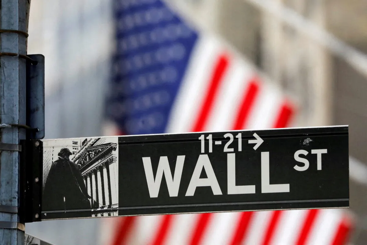 A street sign for Wall Street outside the New York Stock Exchange (NYSE) in New York on July 19, 2021. (Andrew Kelly/Reuters)