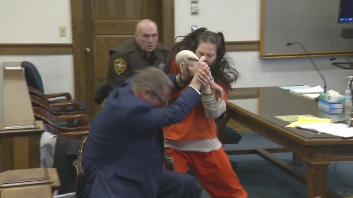 Taylor Schabusiness attacks her attorney Quinn Jolly in Brown County court in Green Bay, Wis., on Feb. 14, 2023. (WLUK/Tim Flanigan via AP)