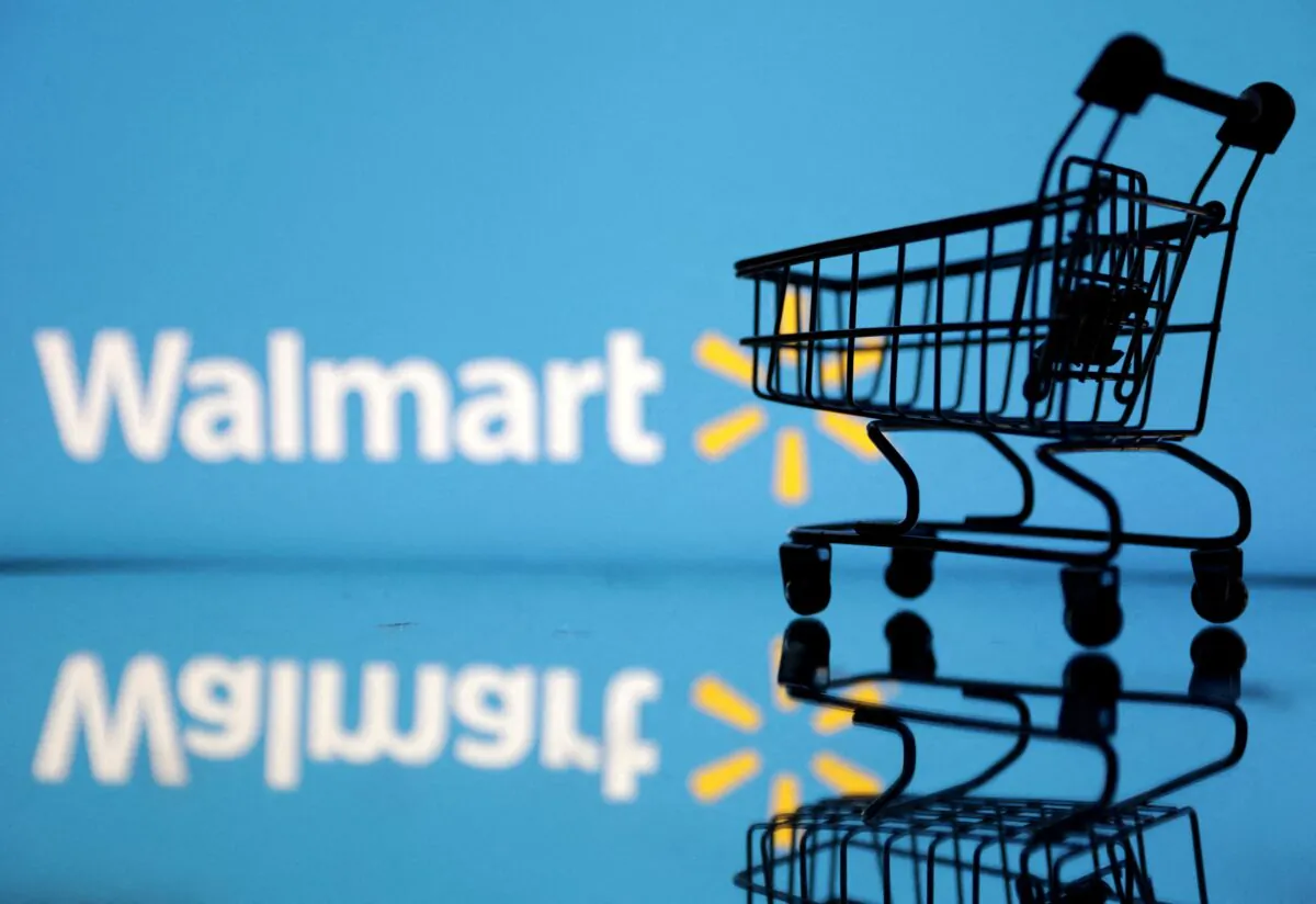 Shopping trolley in front of Walmart logo in an illustration, on July 24, 2022. (Dado Ruvic/Illustration/Reuters)