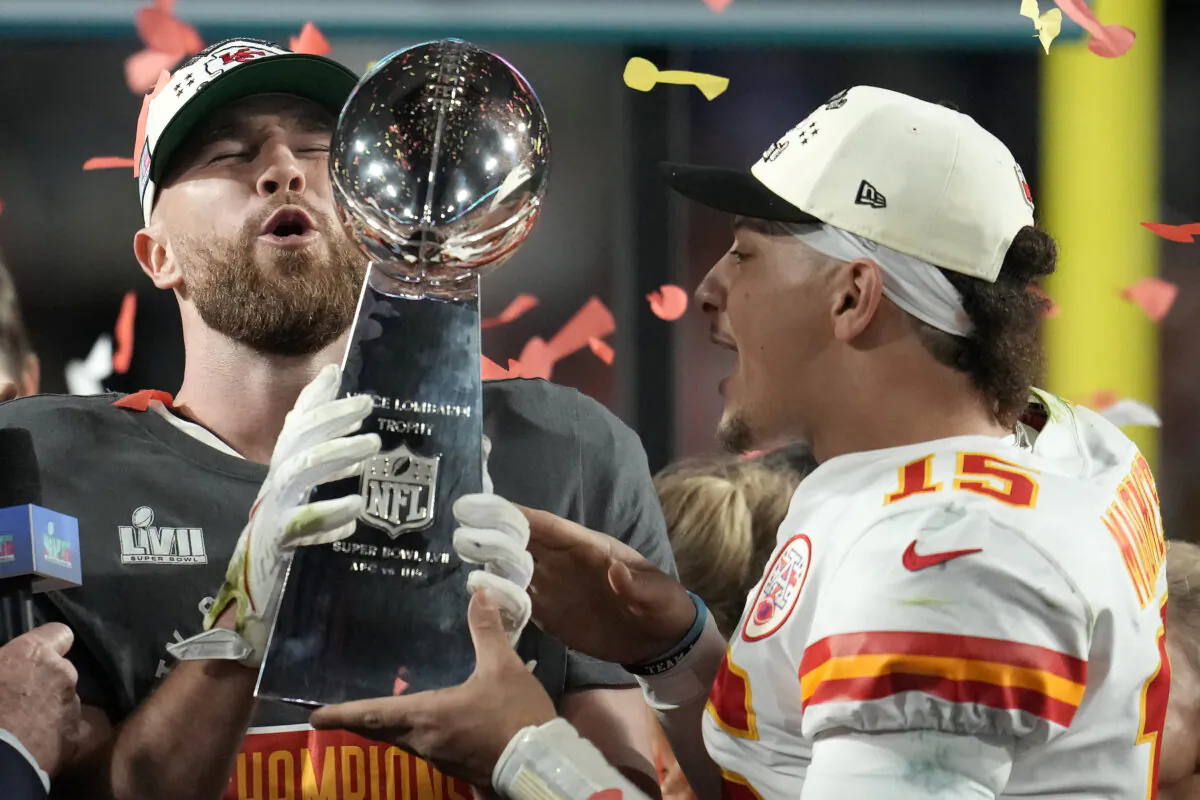 Kansas City Chiefs tight end Travis Kelce, left, and quarterback Patrick Mahomes (15) holds the Vince Lombardi Trophy after the NFL Super Bowl 57 football game against the Philadelphia Eagles, in Glendale, Ariz., Feb. 12, 2023. (Marcio J. Sanchez/AP Photo)