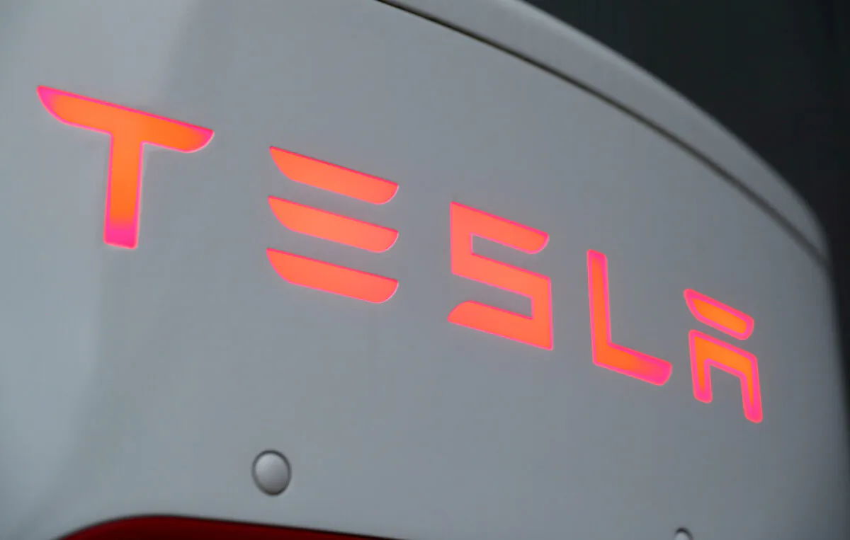 The logo of Tesla at a Tesla Supercharger station in Dietikon, Switzerland, on Oct. 21, 2020. (Arnd Wiegmann/Reuters)