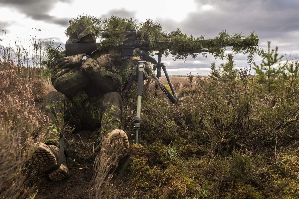 A Canadian Armed Forces sniper successfully completes a stalking exercise during Exercise IRON SWORD at General Silvestras Žukausas Training Area in Pabradė, Lithuania, on Nov. 13, 2015, as part of Operation REASSURANCE. (Corporal Nathan Moulton, Land Task Force Imagery, OP REASSURANCE)